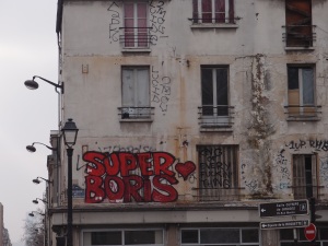It says "Super Boris - King of Every Fuckin' Thing"